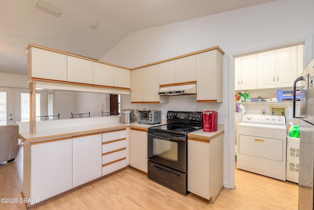 kitchen with lofted ceiling, washer / dryer, white cabinets, electric range, and kitchen peninsula