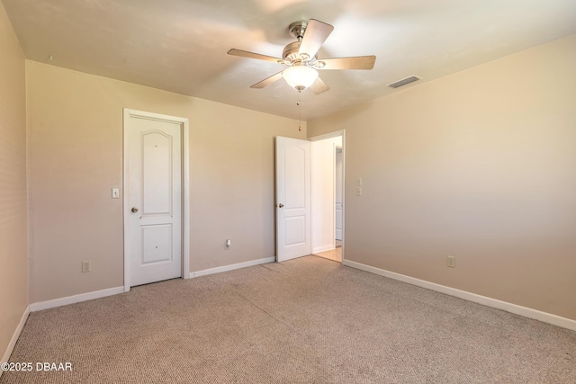 unfurnished bedroom with light colored carpet and ceiling fan