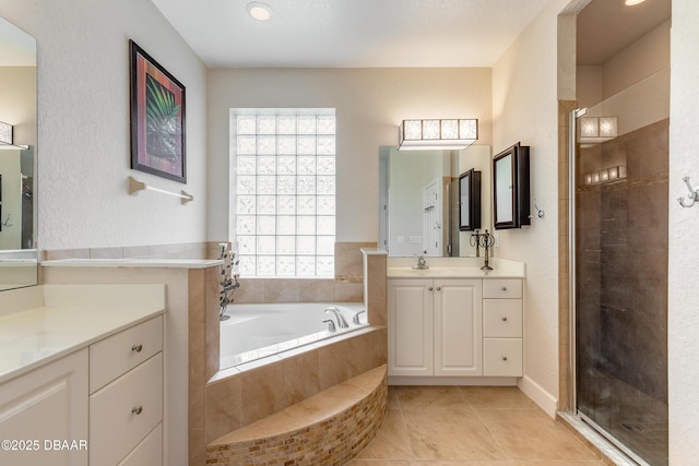 59 Westland Run, Ormond Beach, FL 32174 - full bathroom featuring tile patterned flooring, a stall shower, two vanities, and a bath