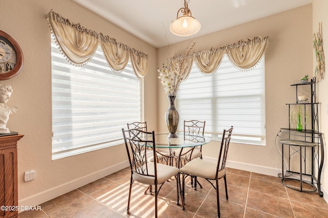 59 Westland Run, Ormond Beach, FL 32174 - dining room featuring healthy amount of natural light, tile patterned flooring, baseboards, and a textured wall