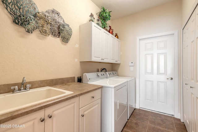 59 Westland Run, Ormond Beach, FL 32174 - laundry room with cabinet space, washing machine and clothes dryer, and dark tile patterned flooring