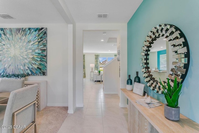 hallway featuring light tile patterned floors