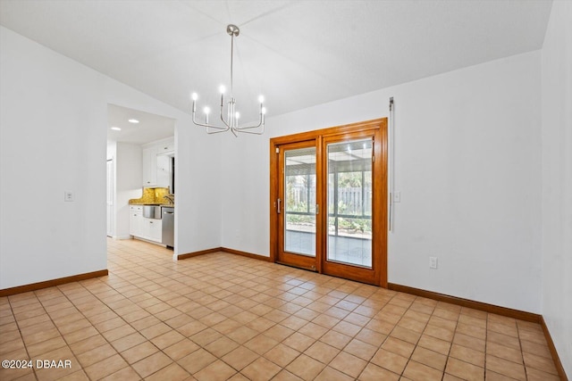 unfurnished room featuring lofted ceiling, light tile patterned floors, and a chandelier