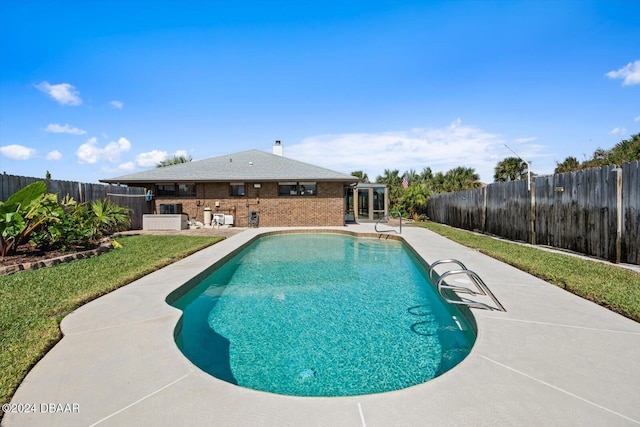 view of swimming pool featuring a patio area