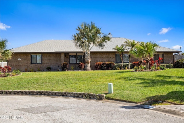 ranch-style home with a front yard