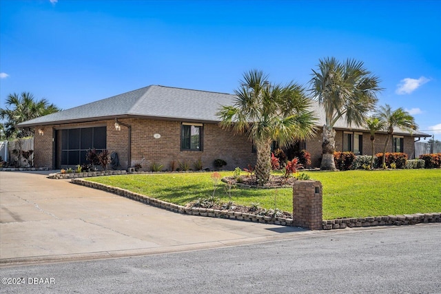 ranch-style house featuring a front lawn