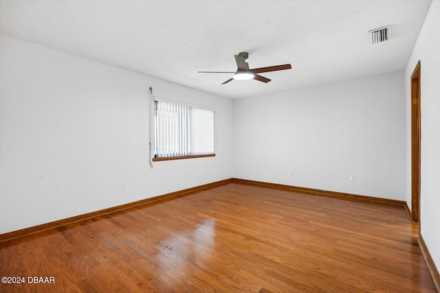 spare room featuring ceiling fan and hardwood / wood-style flooring