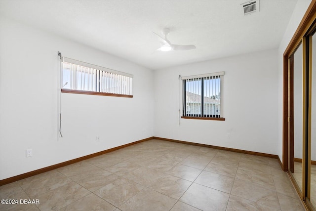 unfurnished bedroom featuring ceiling fan