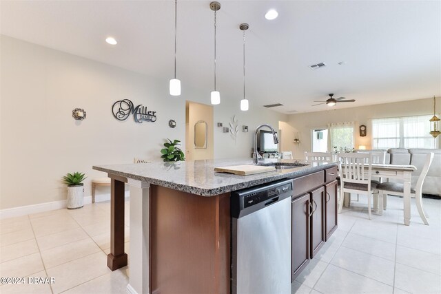 kitchen with sink, ceiling fan, an island with sink, pendant lighting, and dishwasher