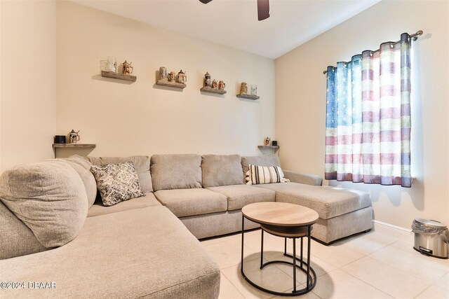 tiled living room featuring ceiling fan