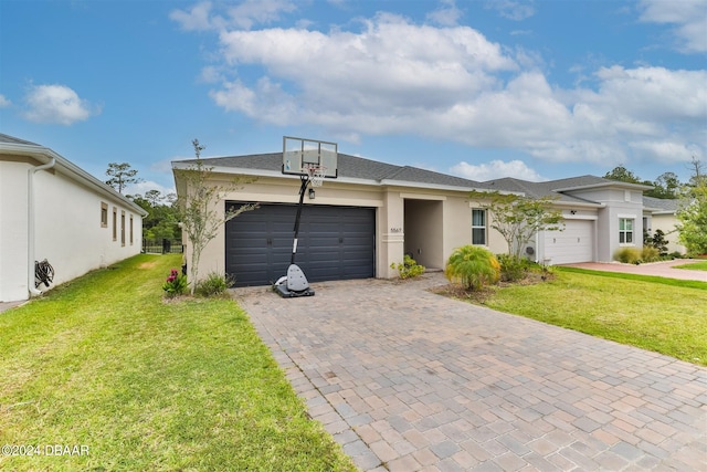 ranch-style house with a garage and a front yard