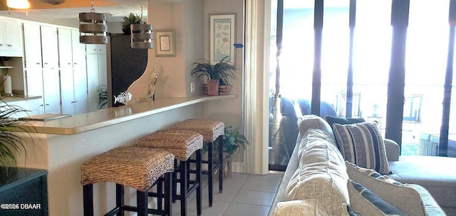 interior space with a wealth of natural light and light tile patterned flooring