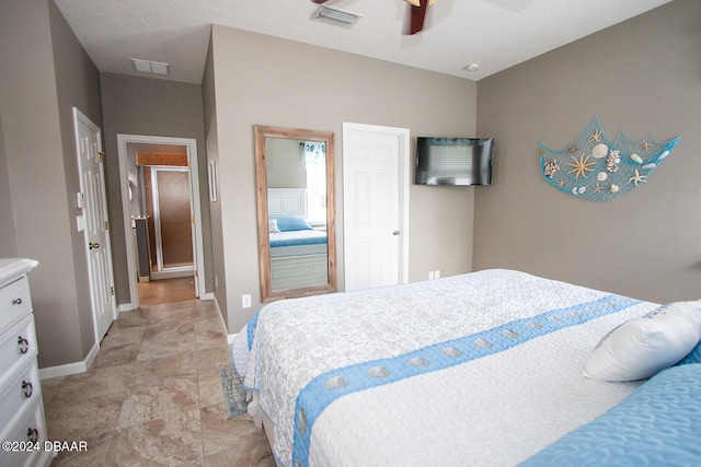 bedroom featuring a ceiling fan, visible vents, and baseboards