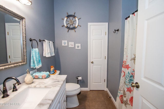 full bath with toilet, tile patterned flooring, vanity, and baseboards