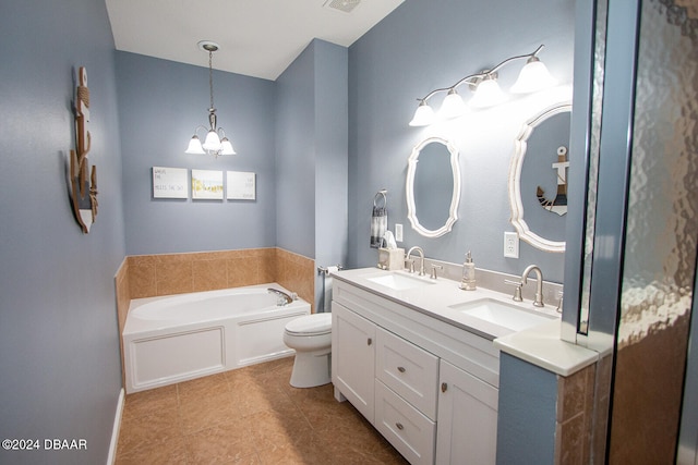 bathroom with a bath, double vanity, a chandelier, and a sink