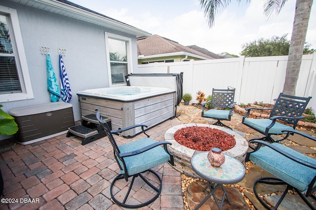 view of patio / terrace with a hot tub