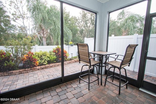 sunroom / solarium featuring a wealth of natural light