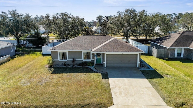 view of front of home featuring a garage and a front lawn