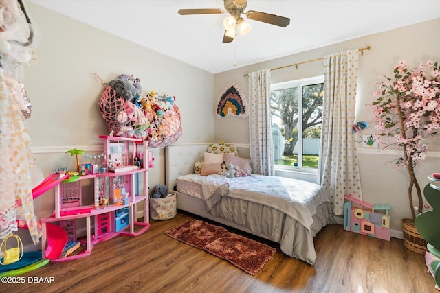 bedroom featuring wood-type flooring and ceiling fan