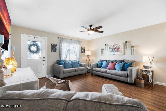 living room with dark hardwood / wood-style floors and ceiling fan