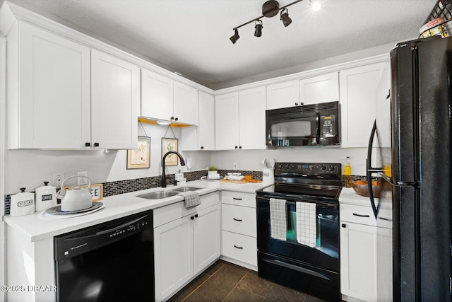 kitchen with white cabinetry, sink, and black appliances