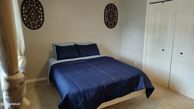 carpeted bedroom featuring a closet