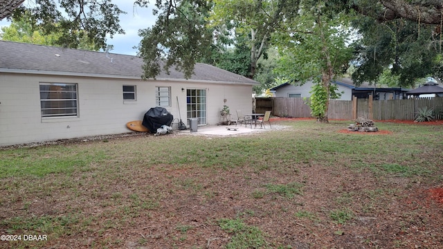 view of yard with a patio and a fire pit