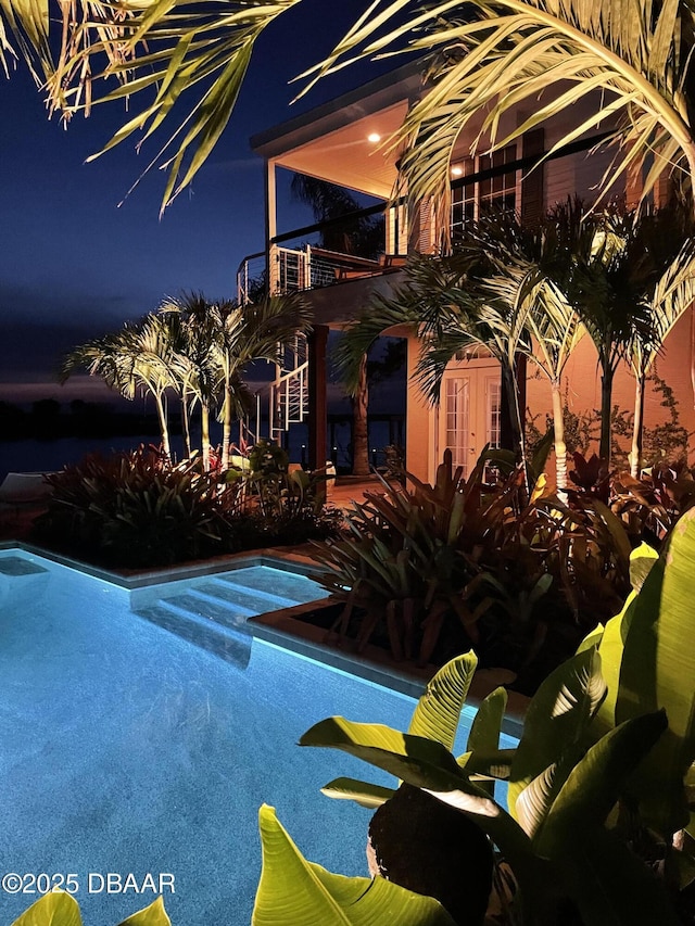 3212 John Anderson Dr, Ormond Beach, FL 32176 - pool at twilight with an outdoor pool