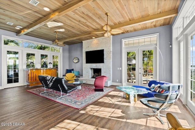 3212 John Anderson Dr, Ormond Beach, FL 32176 - living area with wood finished floors, beamed ceiling, french doors, and ceiling fan
