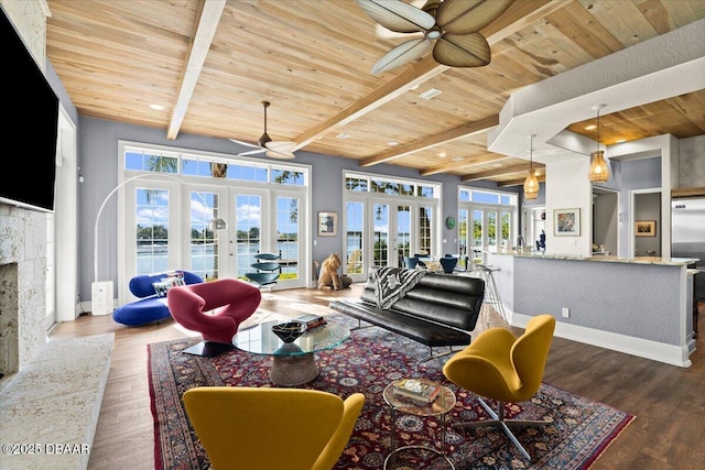 3212 John Anderson Dr, Ormond Beach, FL 32176 - living area with french doors, a ceiling fan, wooden ceiling with exposed beams, and wood finished floors