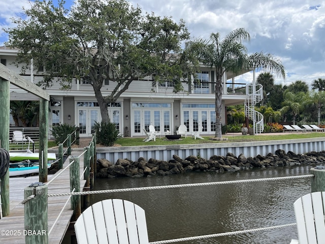 3212 John Anderson Dr, Ormond Beach, FL 32176 - rear view of house with french doors, a water view, and stairs