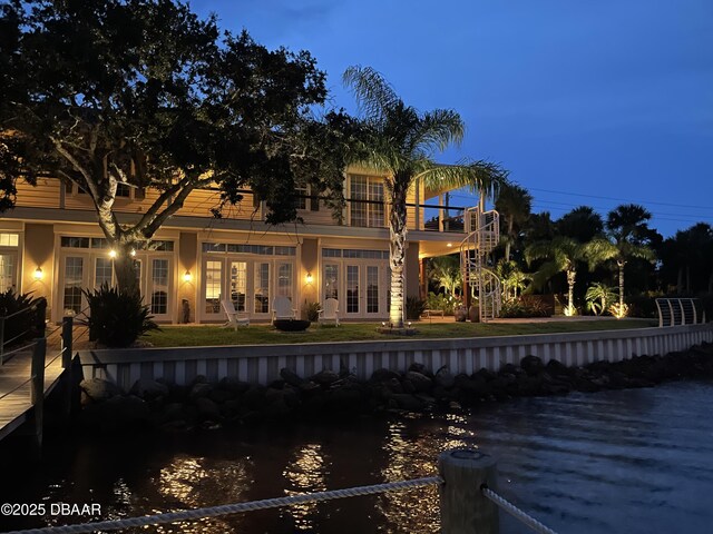 3212 John Anderson Dr, Ormond Beach, FL 32176 - rear view of house featuring a balcony, french doors, and a water view