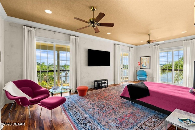 3212 John Anderson Dr, Ormond Beach, FL 32176 - bedroom with wood finished floors, baseboards, ceiling fan, ornamental molding, and access to exterior