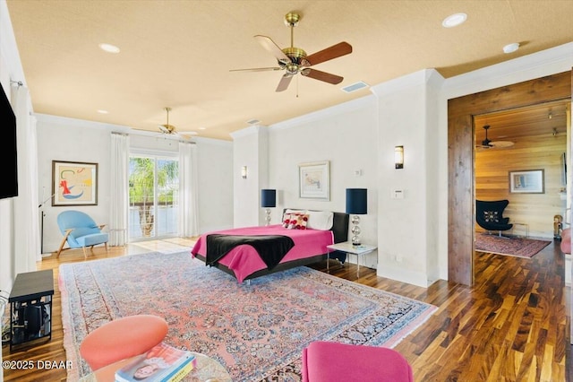 bedroom featuring access to outside, visible vents, ornamental molding, and wood finished floors