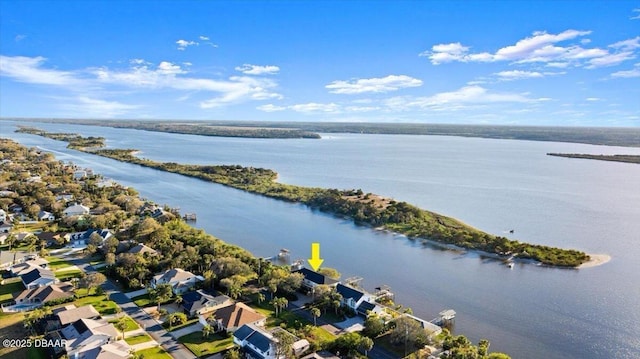 drone / aerial view with a residential view and a water view