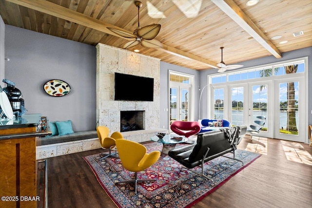 3212 John Anderson Dr, Ormond Beach, FL 32176 - living room with wood finished floors, beamed ceiling, a ceiling fan, and wooden ceiling