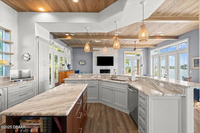 3212 John Anderson Dr, Ormond Beach, FL 32176 - kitchen with wood ceiling, french doors, a large island with sink, and a sink