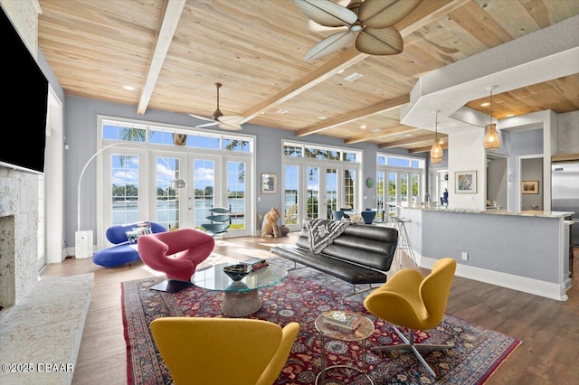 living room featuring wooden ceiling, wood finished floors, french doors, and ceiling fan