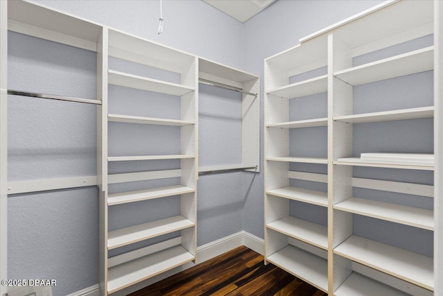 3212 John Anderson Dr, Ormond Beach, FL 32176 - walk in closet featuring dark wood-type flooring