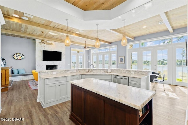 kitchen featuring wooden ceiling, french doors, and a spacious island