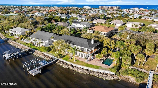 aerial view with a residential view and a water view