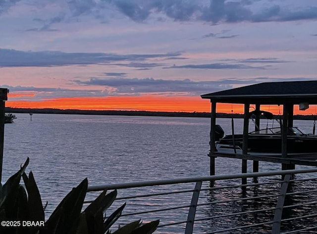 view of dock featuring boat lift and a water view