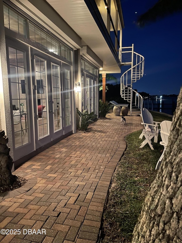 3212 John Anderson Dr, Ormond Beach, FL 32176 - patio at twilight with french doors