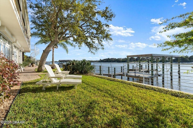 3212 John Anderson Dr, Ormond Beach, FL 32176 - dock area with a water view and a yard