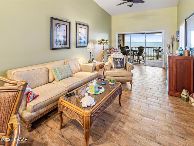 living area with a ceiling fan and wood finished floors