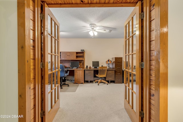 home office featuring french doors and light colored carpet