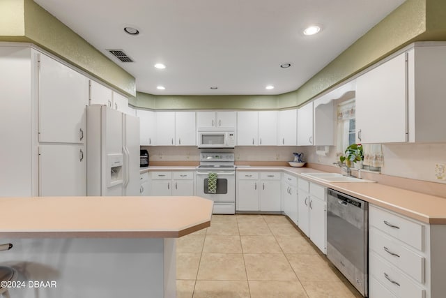 kitchen featuring white cabinets, white appliances, and sink