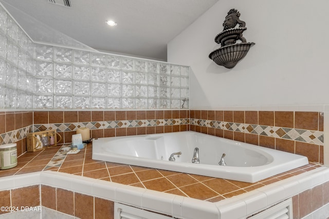 bathroom featuring a relaxing tiled tub