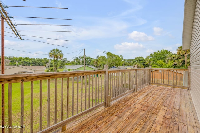 wooden deck with a yard