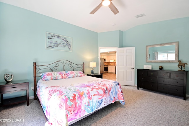 22 Sand Dune Dr, New Smyrna Beach, FL 32169 - carpeted bedroom featuring lofted ceiling, freestanding refrigerator, and ceiling fan